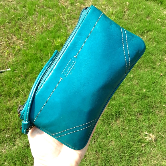 Coach Handbags - Coach oversized, leather side zipper wristlet in brilliant turquoise